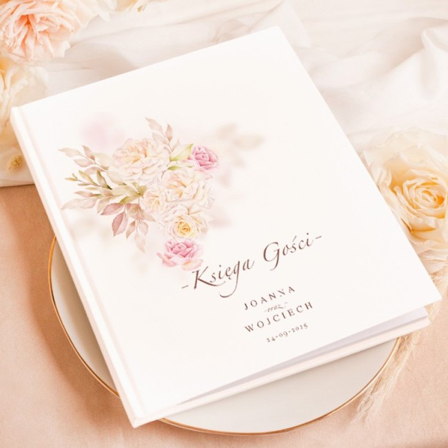 Biała księga z kolorowymi kwiatami na wpisy gości weselnych.
