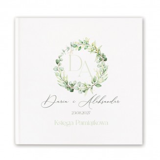 Atrakcja weselna w postaci księgi gości z piękną grafiką w postaci wianka.