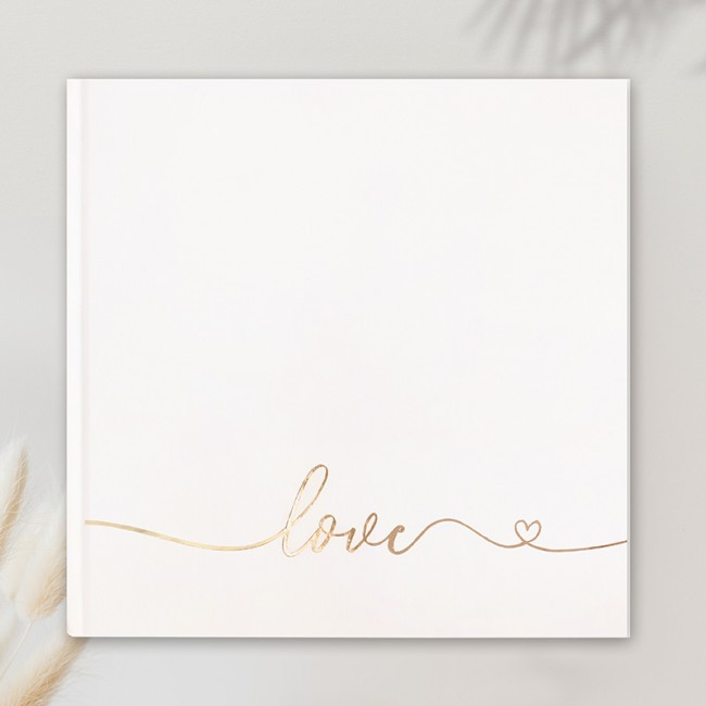 Księga gości weselnych w białym kolorze ze złotym napisem Love