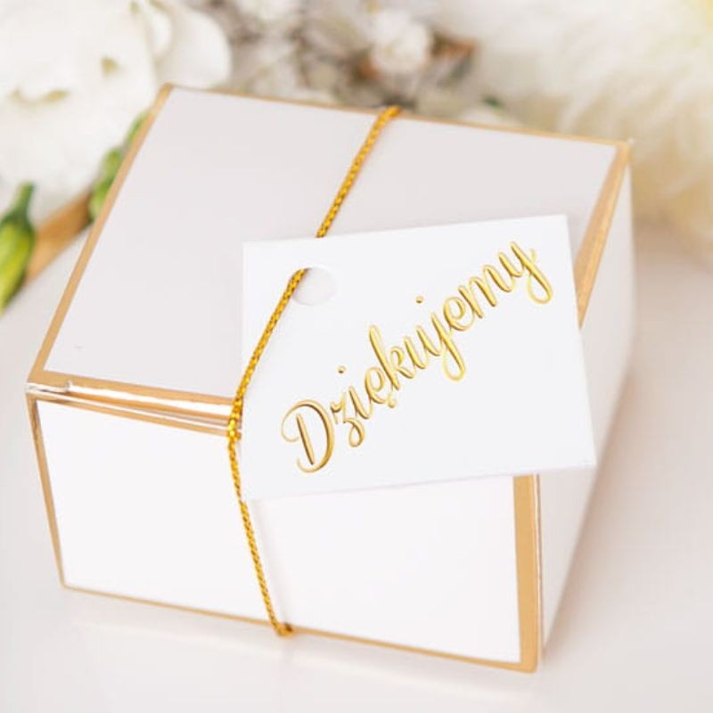 Bileciki białe ze złotym napisem dziękujemy.