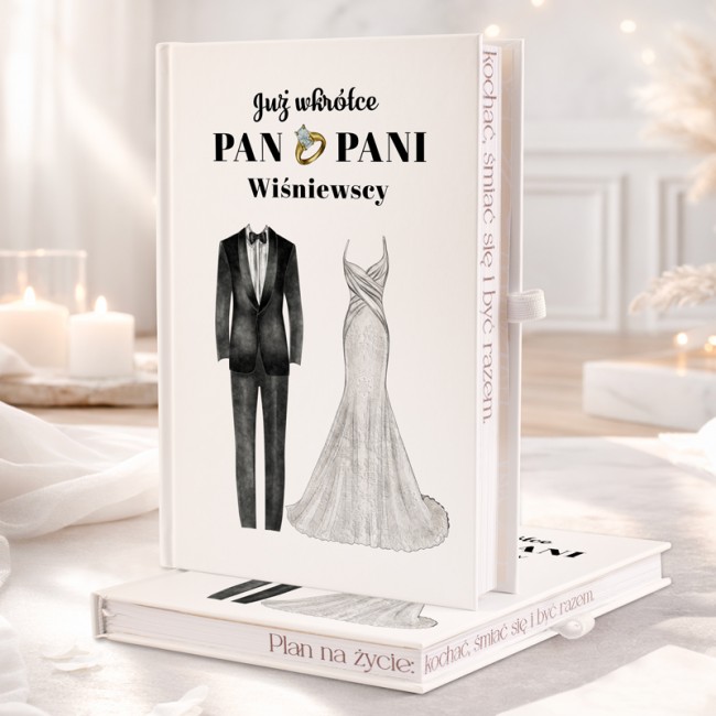 Personalizowany planer ślubny z motywem sukienki i garnituru.