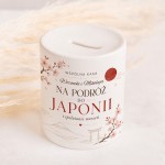 Ceramiczna skarbonka z imionami jako prezent ślubny dla nowożeńców.