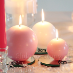 Świeczki okrągłe w kolorach do wyboru. Romantyczna dekoracja na stół
