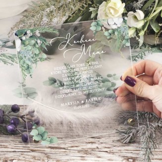 Akrylowa, przezroczysta tabliczka podziękowanie dla rodziców na wesele. Grafika zielonych gałązek i kwiatów bawełny.